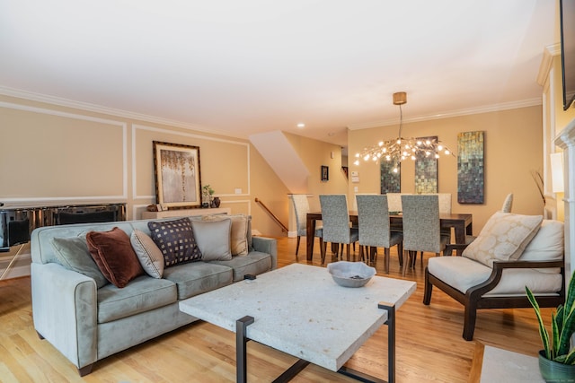 645 Prospect Ave Unit 9, West Hartford, CT 06105 - living room with a chandelier, crown molding, and light wood finished floors