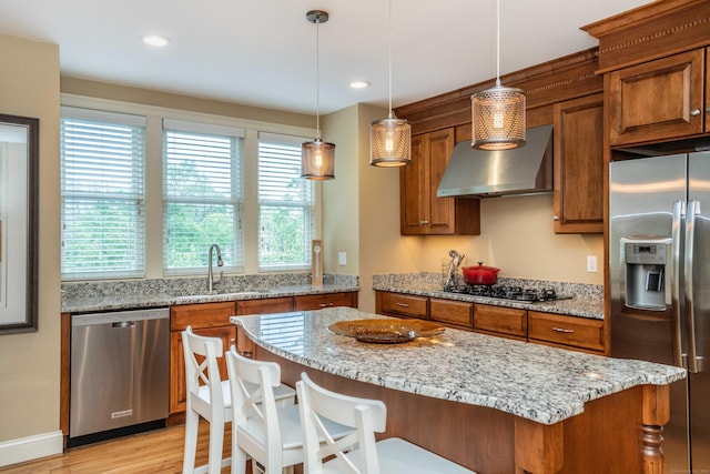 645 Prospect Ave Unit 9, West Hartford, CT 06105 - kitchen featuring appliances with stainless steel finishes, a sink, brown cabinetry, a center island, and recessed lighting