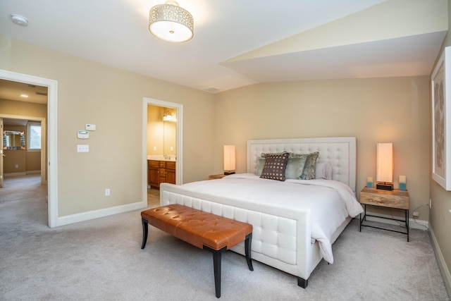 645 Prospect Ave Unit 9, West Hartford, CT 06105 - bedroom featuring light colored carpet, baseboards, lofted ceiling, and ensuite bath