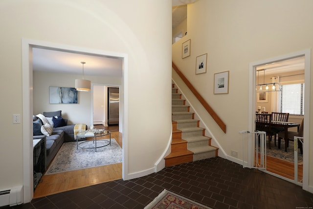 47 Old S Salem Road, Ridgefield, CT 06877 - stairs featuring a baseboard heating unit and baseboards