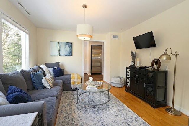 47 Old S Salem Road, Ridgefield, CT 06877 - living room featuring light wood-type flooring, a baseboard radiator, and baseboards