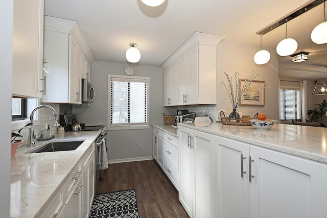 47 Old S Salem Road, Ridgefield, CT 06877 - kitchen with stainless steel appliances, a sink, white cabinetry, and tasteful backsplash