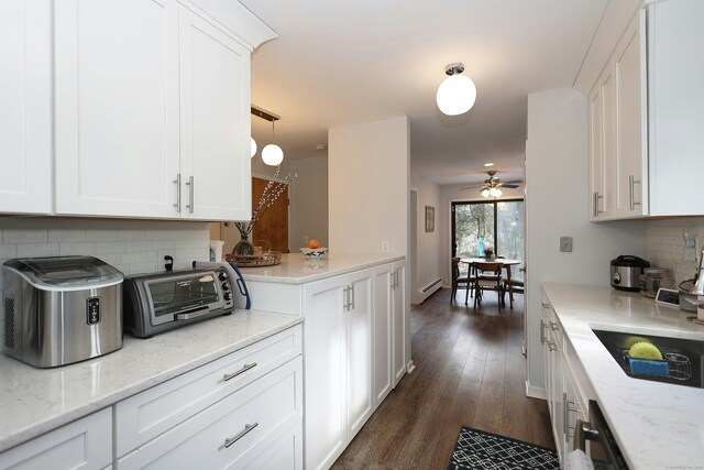 47 Old S Salem Road, Ridgefield, CT 06877 - kitchen with a baseboard radiator, ceiling fan, decorative backsplash, and white cabinets