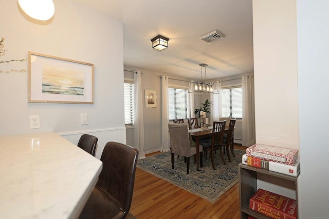 47 Old S Salem Road, Ridgefield, CT 06877 - dining room with wood finished floors, wainscoting, and a chandelier