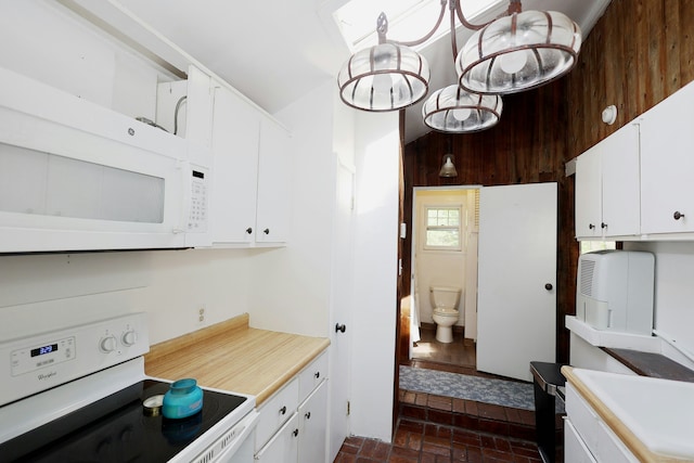 47 Old S Salem Road, Ridgefield, CT 06877 - kitchen with white appliances, brick flooring, light countertops, and white cabinetry