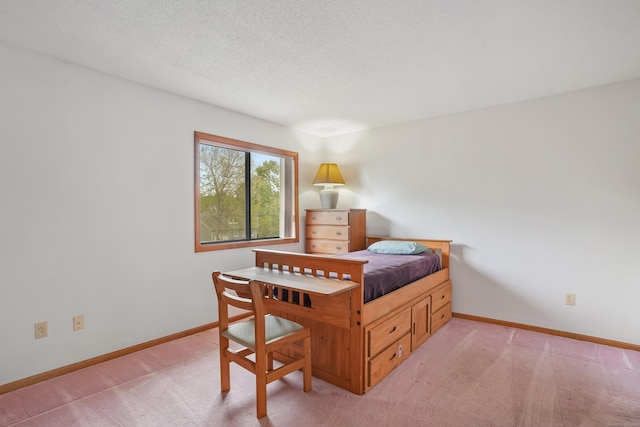 223 Sterling Rd, Trumbull, CT 06611 - bedroom with light colored carpet, baseboards, and a textured ceiling