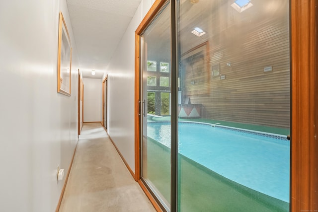 223 Sterling Rd, Trumbull, CT 06611 - corridor with baseboards and concrete floors