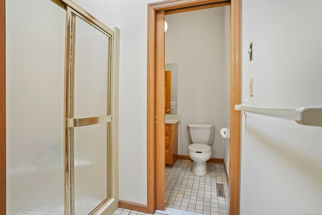 223 Sterling Rd, Trumbull, CT 06611 - bathroom with a shower stall, toilet, vanity, and tile patterned flooring