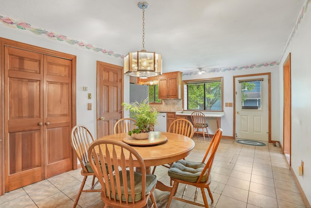 223 Sterling Rd, Trumbull, CT 06611 - dining room with light tile patterned floors, ceiling fan, and baseboards
