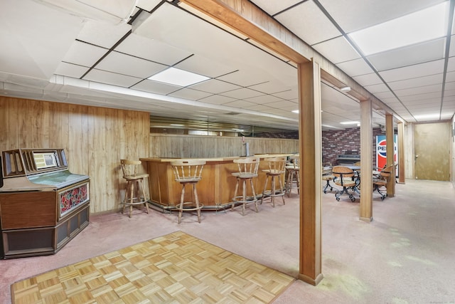 223 Sterling Rd, Trumbull, CT 06611 - indoor dry bar featuring wooden walls, carpet flooring, and a paneled ceiling