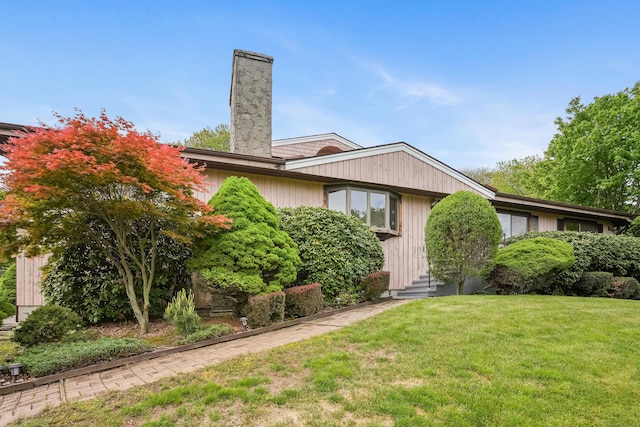 223 Sterling Rd, Trumbull, CT 06611 - view of front of property with a chimney, a front yard, and entry steps