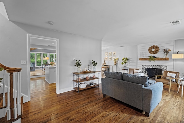 124 Killian Ave, Trumbull, CT 06611 - living area featuring wood finished floors, a fireplace, and baseboards