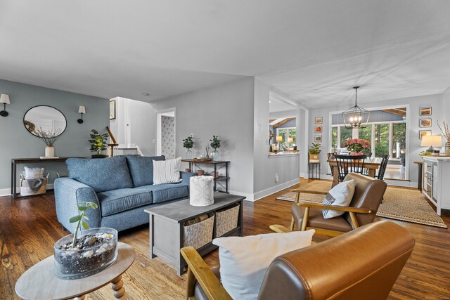 124 Killian Ave, Trumbull, CT 06611 - living room with a chandelier, wood finished floors, and baseboards