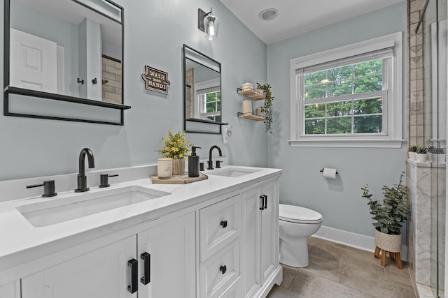 124 Killian Ave, Trumbull, CT 06611 - bathroom featuring toilet, double vanity, a shower with shower door, and baseboards