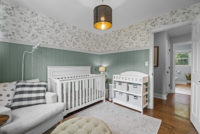 124 Killian Ave, Trumbull, CT 06611 - bedroom with wallpapered walls, wood finished floors, and baseboards