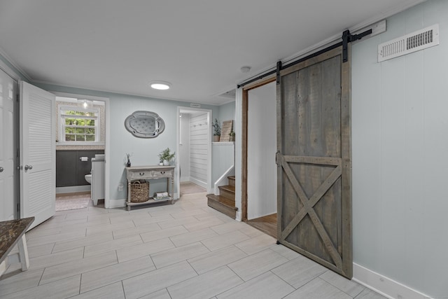 124 Killian Ave, Trumbull, CT 06611 - living area with a barn door, stairs, and baseboards