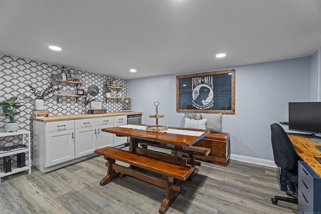 124 Killian Ave, Trumbull, CT 06611 - dining space with light wood finished floors, a desk, a decorative wall, and recessed lighting
