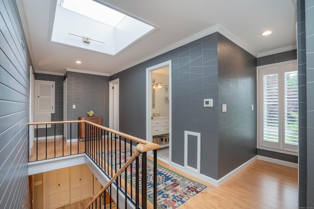 31 Westcliff Dr, West Hartford, CT 06117 - hallway featuring crown molding, an upstairs landing, healthy amount of natural light, wood finished floors, and a skylight