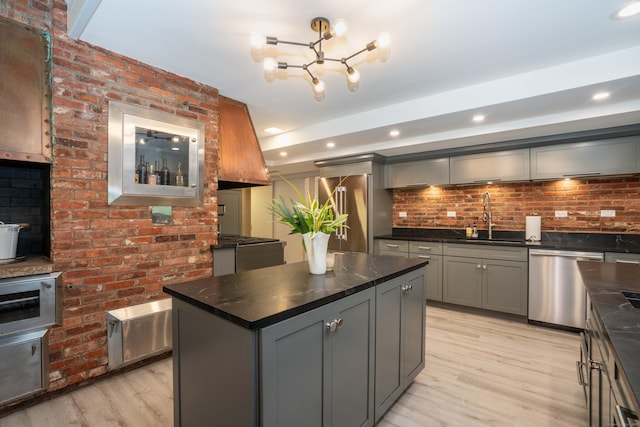 31 Westcliff Dr, West Hartford, CT 06117 - kitchen with appliances with stainless steel finishes, a sink, gray cabinets, light wood-style flooring, and a chandelier