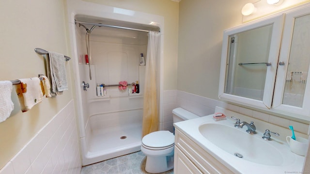 500 Prospect St Apt 4B, New Haven, CT 06511 - full bath featuring toilet, a shower stall, vanity, tile walls, and a wainscoted wall