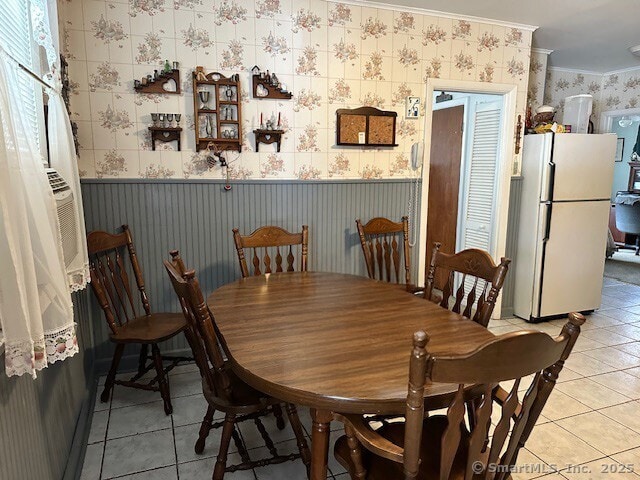 109 Central Ave, Wolcott, CT 06716 - dining area featuring wallpapered walls, light tile patterned floors, and crown molding