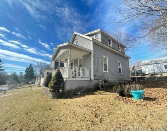 597 Cooke St, Waterbury, CT 06710 - view of side of property featuring a porch and a yard