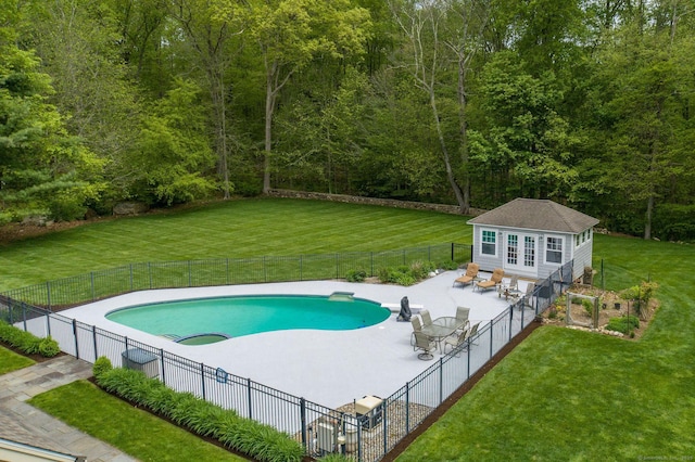 188 Bartlett Dr, Madison, CT 06443 - view of pool featuring an exterior structure, an outbuilding, a patio area, and a wooded view