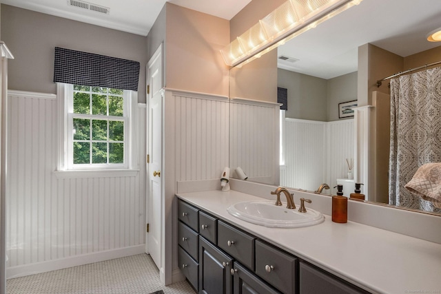 188 Bartlett Dr, Madison, CT 06443 - bathroom featuring a wainscoted wall, vanity, and a shower with curtain