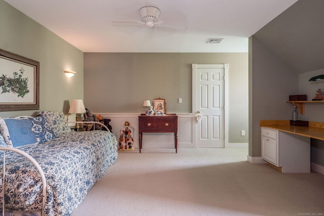 188 Bartlett Dr, Madison, CT 06443 - bedroom with light carpet, a wainscoted wall, a ceiling fan, and an office area
