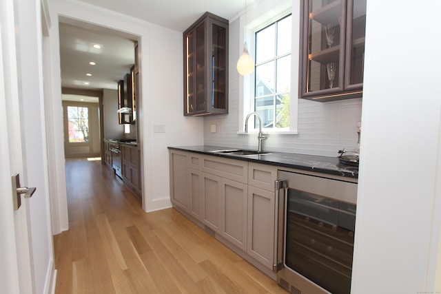 22 Apple Tree Trl, Westport, CT 06880 - bar with beverage cooler, a sink, light wood finished floors, plenty of natural light, and recessed lighting