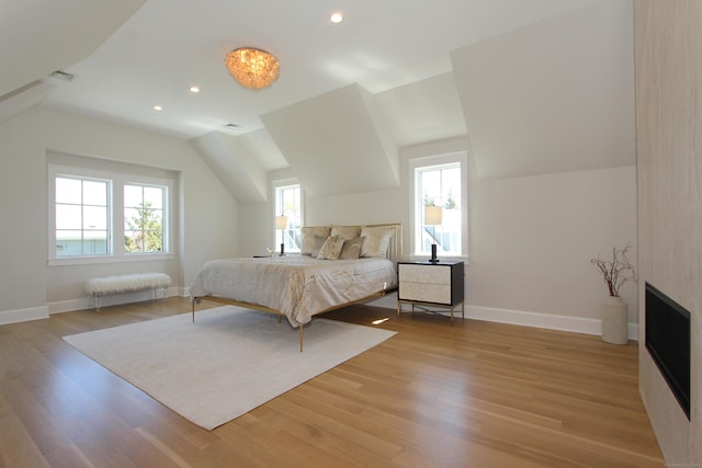 22 Apple Tree Trl, Westport, CT 06880 - bedroom with multiple windows, vaulted ceiling, wood finished floors, baseboards, and recessed lighting