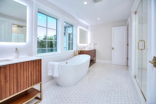 22 Apple Tree Trl, Westport, CT 06880 - bathroom featuring a stall shower, tile patterned floors, vanity, a freestanding tub, and recessed lighting