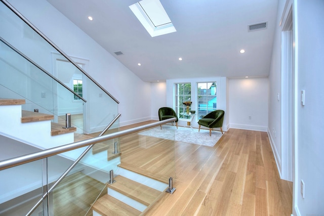 22 Apple Tree Trl, Westport, CT 06880 - staircase featuring a skylight, wood finished floors, and recessed lighting