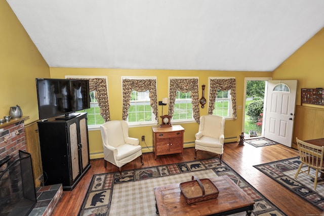 40 Fountainhead Rd, Plymouth, CT 06786 - living area with lofted ceiling, wood finished floors, and a baseboard heating unit