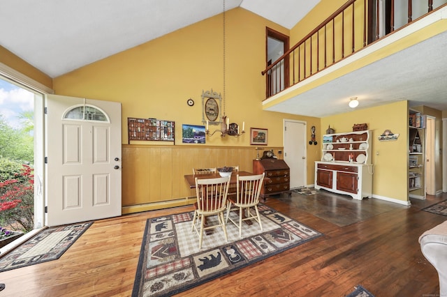 40 Fountainhead Rd, Plymouth, CT 06786 - dining area featuring a baseboard heating unit, wood finished floors, and high vaulted ceiling