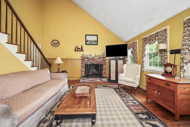 40 Fountainhead Rd, Plymouth, CT 06786 - living area featuring wood finished floors, high vaulted ceiling, a fireplace, stairs, and wainscoting