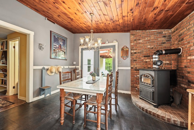 40 Fountainhead Rd, Plymouth, CT 06786 - dining room with a chandelier, a wood stove, wooden ceiling, and baseboards