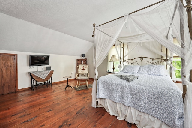 40 Fountainhead Rd, Plymouth, CT 06786 - bedroom featuring wood-type flooring, lofted ceiling, multiple windows, baseboards, and a textured ceiling