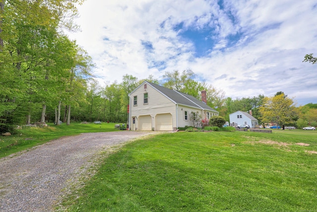 40 Fountainhead Rd, Plymouth, CT 06786 - view of side of home featuring a chimney, a garage, gravel driveway, and a lawn