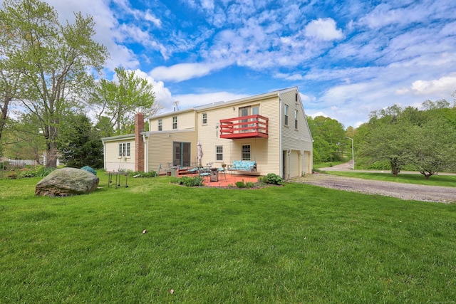 40 Fountainhead Rd, Plymouth, CT 06786 - rear view of property featuring gravel driveway, an attached garage, a chimney, a yard, and a balcony