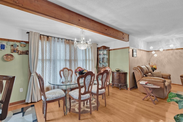 41 Farm Dr Unit 41, Farmington, CT 06032 - dining room with a chandelier, wood finished floors, a textured ceiling, beam ceiling, and baseboards