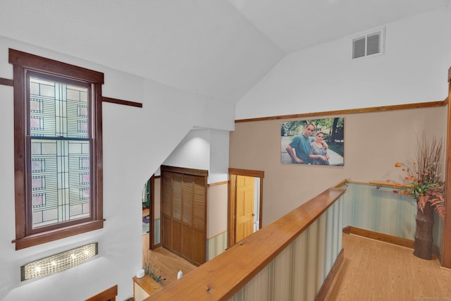 41 Farm Dr Unit 41, Farmington, CT 06032 - hall featuring light wood-style floors, vaulted ceiling, and an upstairs landing