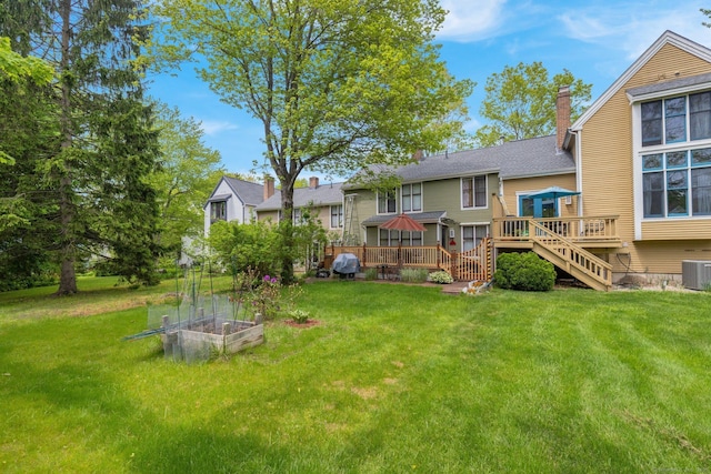 41 Farm Dr Unit 41, Farmington, CT 06032 - view of grassy yard featuring a deck, a garden, central AC, and stairs