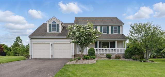 136 Windmill Hl, Wethersfield, CT 06109 - view of front facade with a porch, an attached garage, asphalt driveway, and a front lawn