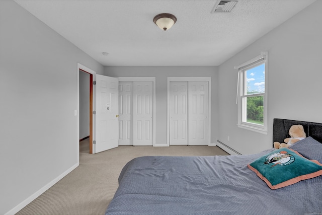 136 Windmill Hl, Wethersfield, CT 06109 - bedroom featuring carpet, two closets, baseboards, and a baseboard heating unit