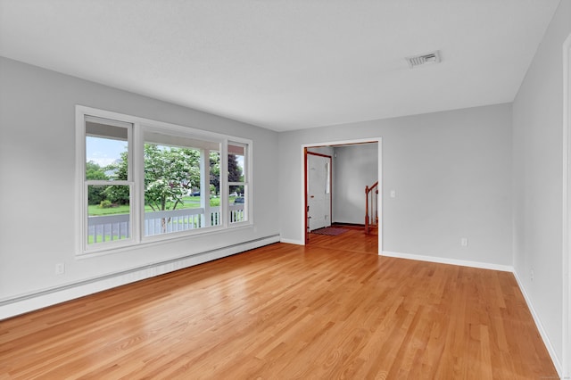 136 Windmill Hl, Wethersfield, CT 06109 - empty room with baseboard heating, light wood finished floors, and baseboards
