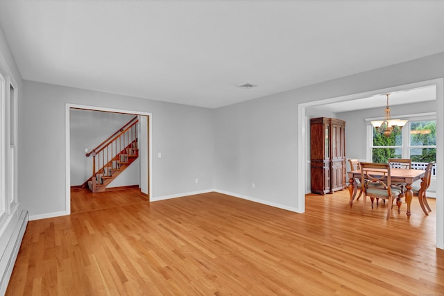 136 Windmill Hl, Wethersfield, CT 06109 - unfurnished room with a baseboard radiator, light wood-style floors, a chandelier, stairway, and baseboards