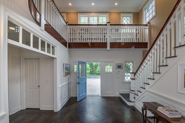 67 Peaceable St, Ridgefield, CT 06877 - foyer entrance featuring a decorative wall, a towering ceiling, stairs, ornamental molding, and recessed lighting