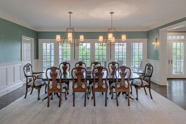67 Peaceable St, Ridgefield, CT 06877 - dining space with a decorative wall, a chandelier, wood finished floors, a wainscoted wall, and french doors