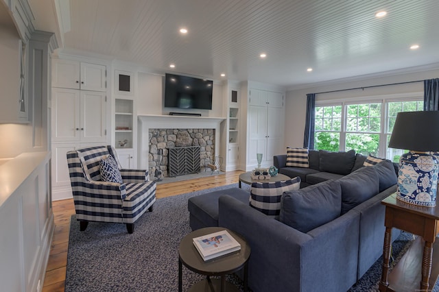 67 Peaceable St, Ridgefield, CT 06877 - living area featuring wood finished floors, a stone fireplace, and recessed lighting